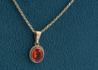 Lot 95 - A fire opal drop pendant