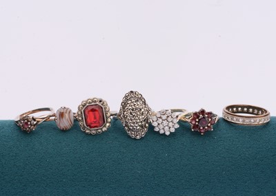 Lot 109 - A collection of seven gem set white metal and base dress rings