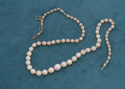 Lot 125 - A string of ovoid pearls