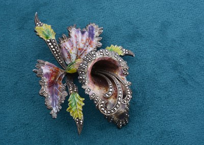 Lot 144 - A large silver enamel and marcasite floral brooch