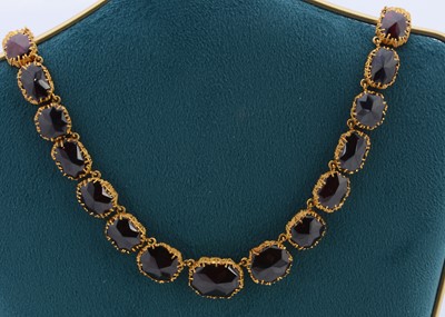 Lot 145 - A modernist garnet and gilt metal fringe necklace