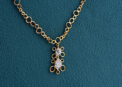 Lot 147 - An 18ct gold diamond pendant necklace by John Donald