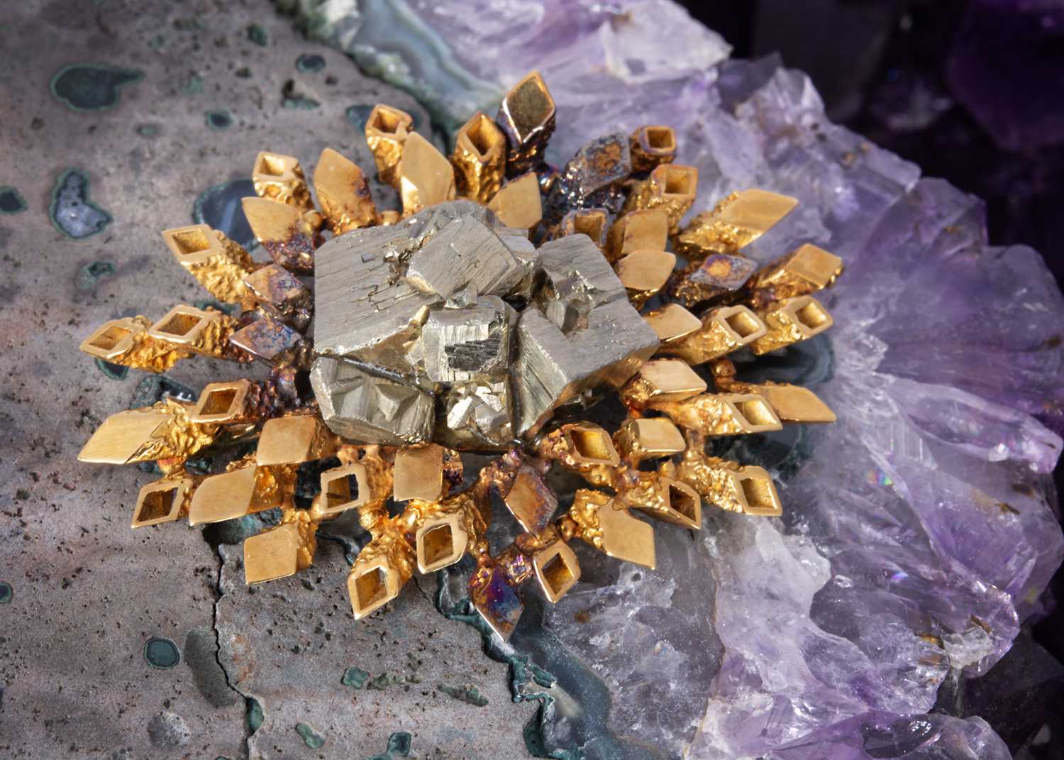 161 - An 18ct gold and pyrite abstract brooch by John Donald,