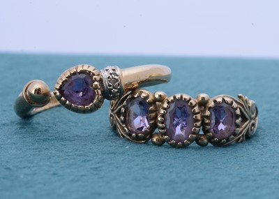 Lot 196 - A three stone amethyst 9ct gold dress ring