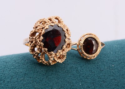 Lot 216 - A 9ct gold garnet dress ring