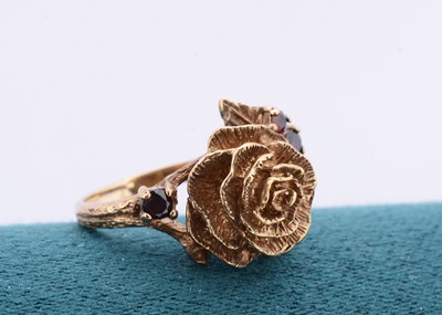 Lot 220 - A 9ct gold and garnet rose dress ring