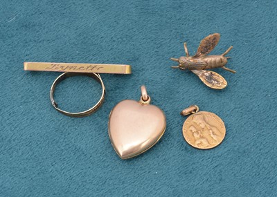 Lot 235 - A small gold safety pin brooch