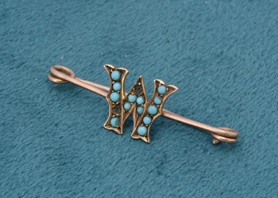 Lot 238 - An early 20th Century initial brooch in turquoise