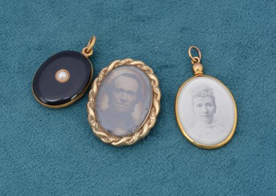 Lot 240 - A 19th Century black enamel and seed pearl mourning locket