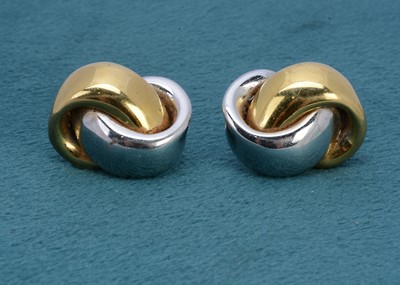 Lot 249 - A pair of 18ct gold bi metal knot ear clips