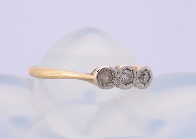 Lot 267 - An 18ct gold and platinum set three stone illusion dress ring