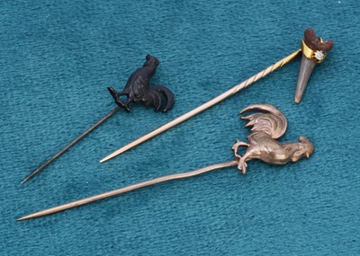 Lot 278 - An Edwardian gold and diamond stick pin set with a pre historic white shark tooth