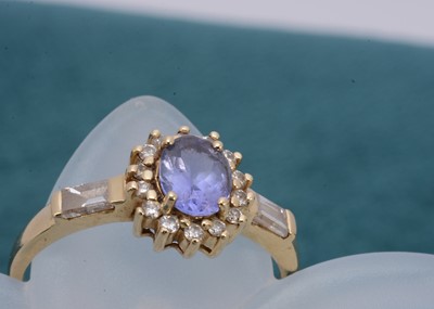 Lot 282 - A 14k continental tanzanite and diamond dress ring