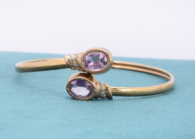 Lot 290 - An amethyst and diamond 9ct gold bangle