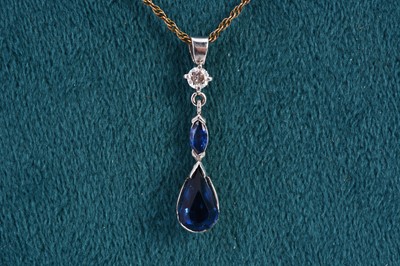 Lot 292 - A sapphire, diamond and paste set white gold pendant