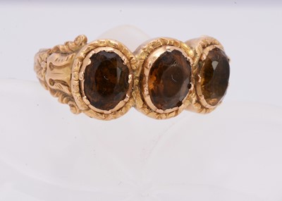 Lot 296 - A 19th Century gold and gem set three stone posey ring