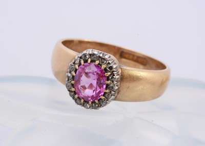 Lot 323 - A pink sapphire and diamond claw set cluster ring