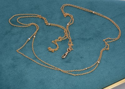 Lot 328 - An opera length yellow gold and seed pearl muff chain