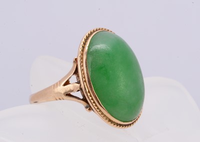 Lot 339 - An Edwardian 18ct gold jadeite jade cabochon dress ring