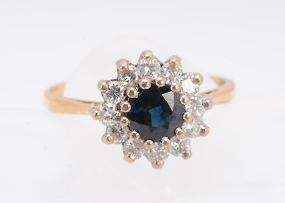 Lot 367 - An 18ct gold sapphire and diamond cluster ring