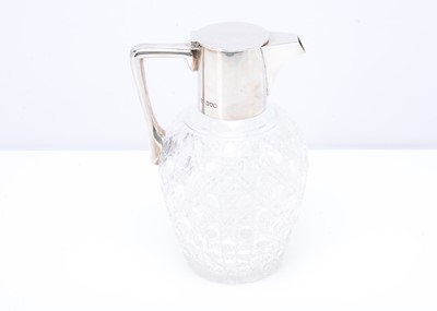 Lot 474 - A late Victorian cut glass and silver mounted claret jug by Goldsmiths & Silversmiths