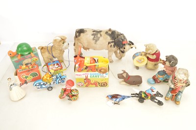 Lot 394 - Various Plastic and Tin clockwork and Battery Toys from 1950's -present (13)