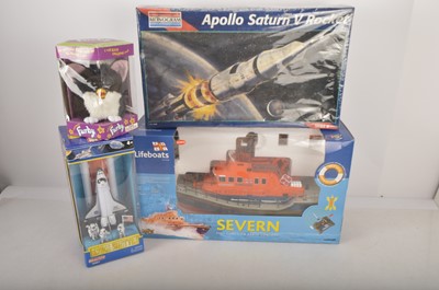 Lot 408 - Tiger Electronics Furby Monogram Saturn V Rocket Kit Realtoy Space Shuttle and RNLI Lifeboat model all boxed (4)