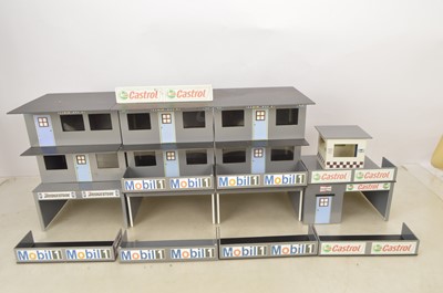 Lot 448 - Large quantity of modern Scalextric, Carrera SCX Buildings including Grandstands Press Tents Pits  Lighting and other items