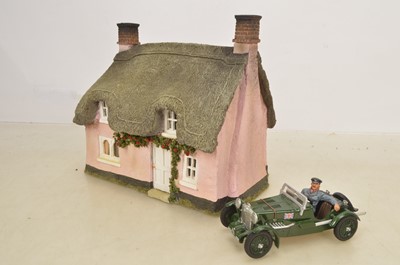 Lot 458 - JG Miniatures Thatched Cottage and King and Country RAF Pilot in an MG Car