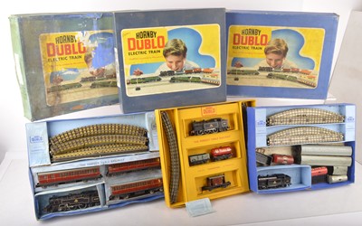 Lot 652 - Two Hornby-Dublo 00 Gauge 3-Rail Goods Train Sets and Passenger Set and an empty box (4)