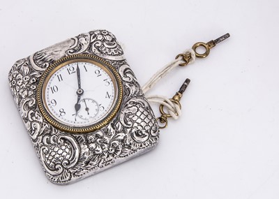 Lot 11 - An Edwardian silver mounted desk clock