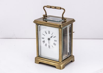 Lot 12 - A late Victorian brass carriage timepiece