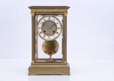 Lot 25 - A Victorian brass and glazed mantle clock