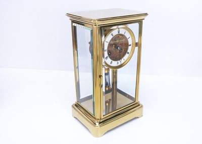 Lot 30 - A modern brass and glazed mantle clock