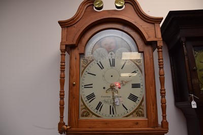 Lot 35 - An early 19th century and later pine long cased clock