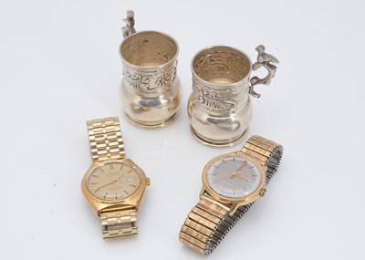 Lot 106 - Two watches and a pair of white metal miniature tankards