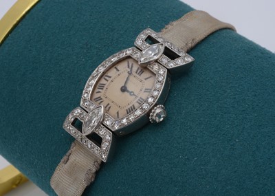 Lot 171 - A c1930s Cartier manual wind platinum and diamond lady's cocktail dress wristwatch