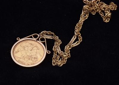 Lot 8 - An Elizabeth II Full Gold Sovereign in mount and gold chain