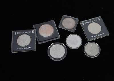 Lot 120 - A collection of seven United States Silver One Dollar coins