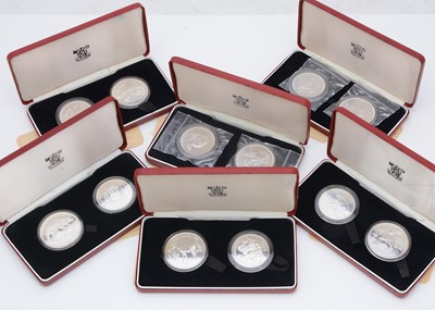 Lot 179 - A collection of six Royal Mint uncirculated silver coin sets from around the world