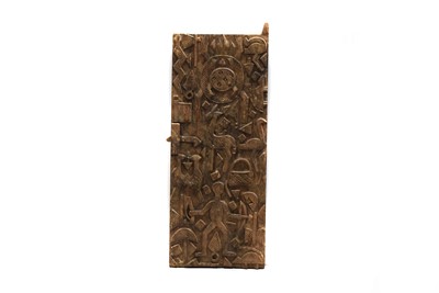 Lot 216 - An African carved wooden door