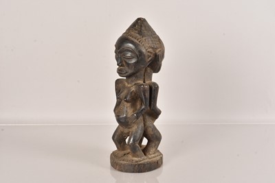 Lot 229 - A Luba Tribe double sided carved figure of a male and female