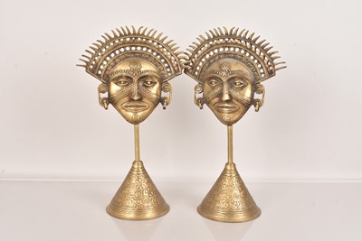 Lot 232 - A pair of Sun God Masks on stands