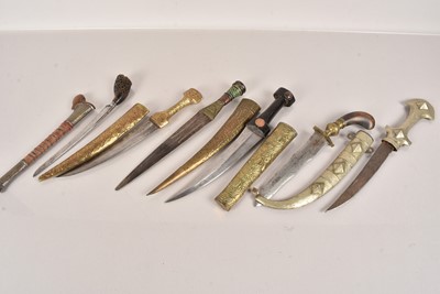 Lot 585 - An assortment of Middle Eastern Daggers