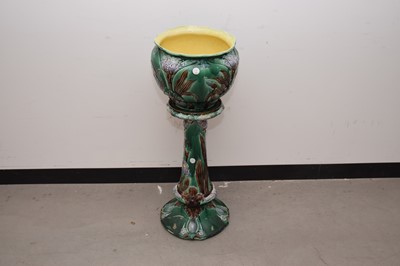 Lot 14 - An early 20th century pottery jardiniere on stand