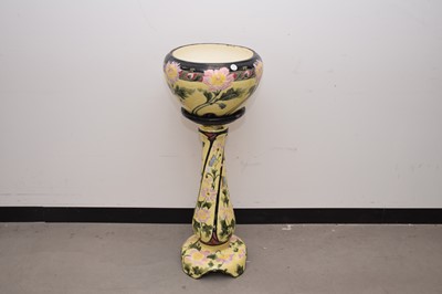 Lot 15 - An early 20th century pottery jardiniere on stand