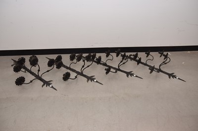 Lot 57 - A set of four modern black painted steel candle wall sconces