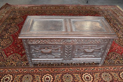 Lot 72 - An 18th century carved oak coffer