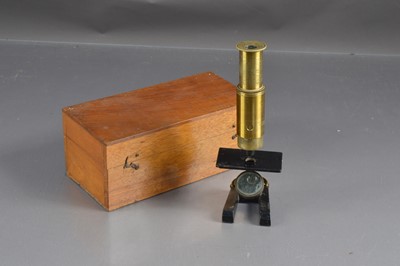 Lot 196 - Small brass student's microscope in a mahogany fitted box