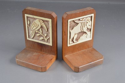 Lot 197 - A pair of Art Deco oak and ceramic bookends